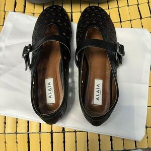 Alaïa Black Perforated Leather Mary Jane Flats